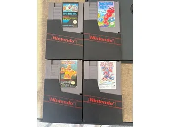 NES-spel: Super Mario Bros., Snake Rattle N Roll, Wrestlemania, Blades of Steel